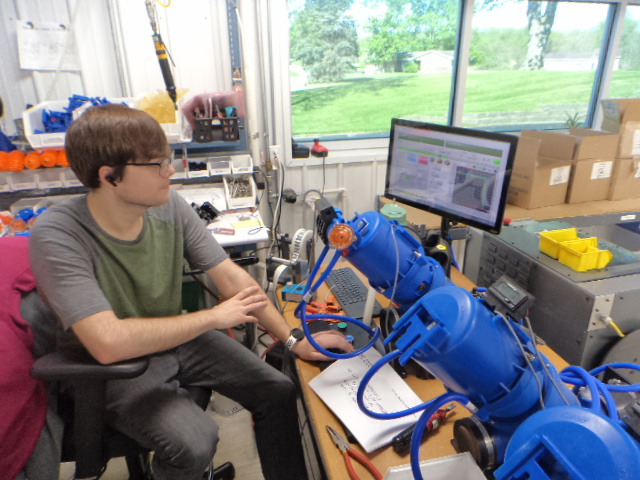 Airvac technician monitoring a valve test bench