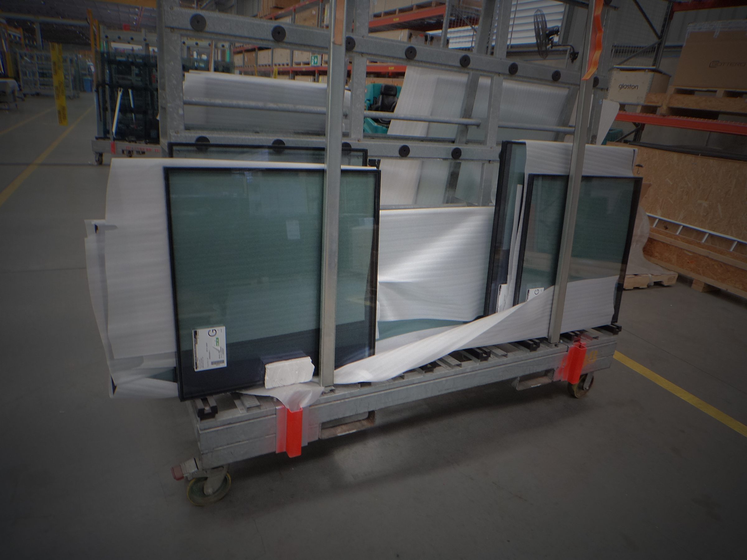Completed insulating glass units protected on a factory transport rack